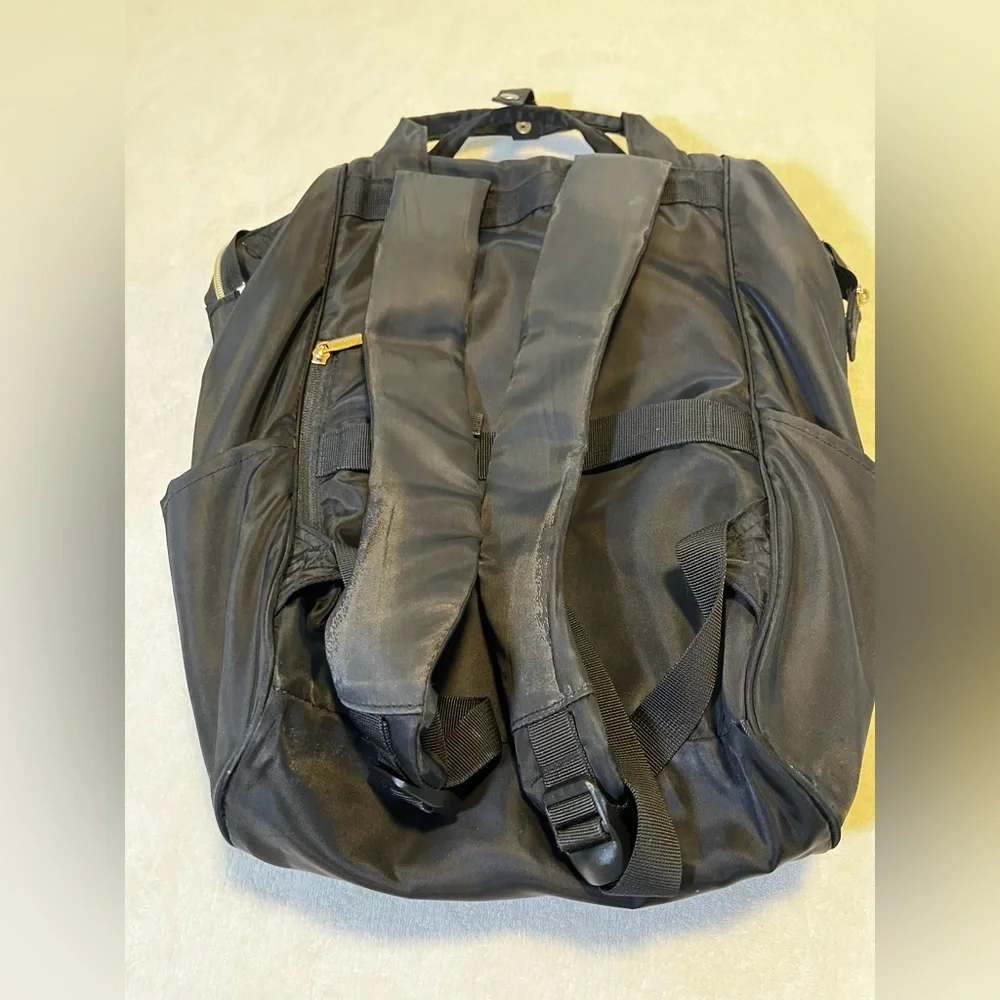 Black Quilted Travel Backpack with Gold Trim